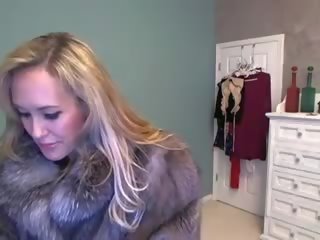 Ms. Brandi has cam fun in her fur coat, and with a toy